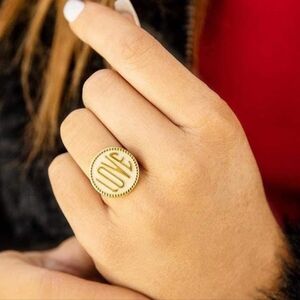 New Plunder Love ring. Cream background with gold words.Adjustable.